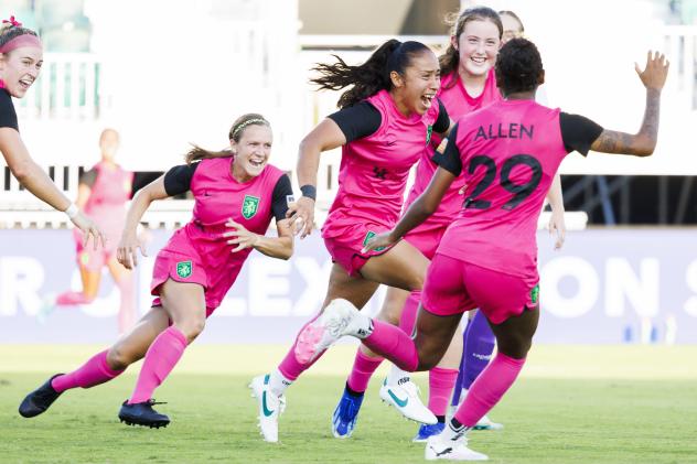 Lexington SC midfielder Kim Mendez celebrates her match-tying goal with her teammates