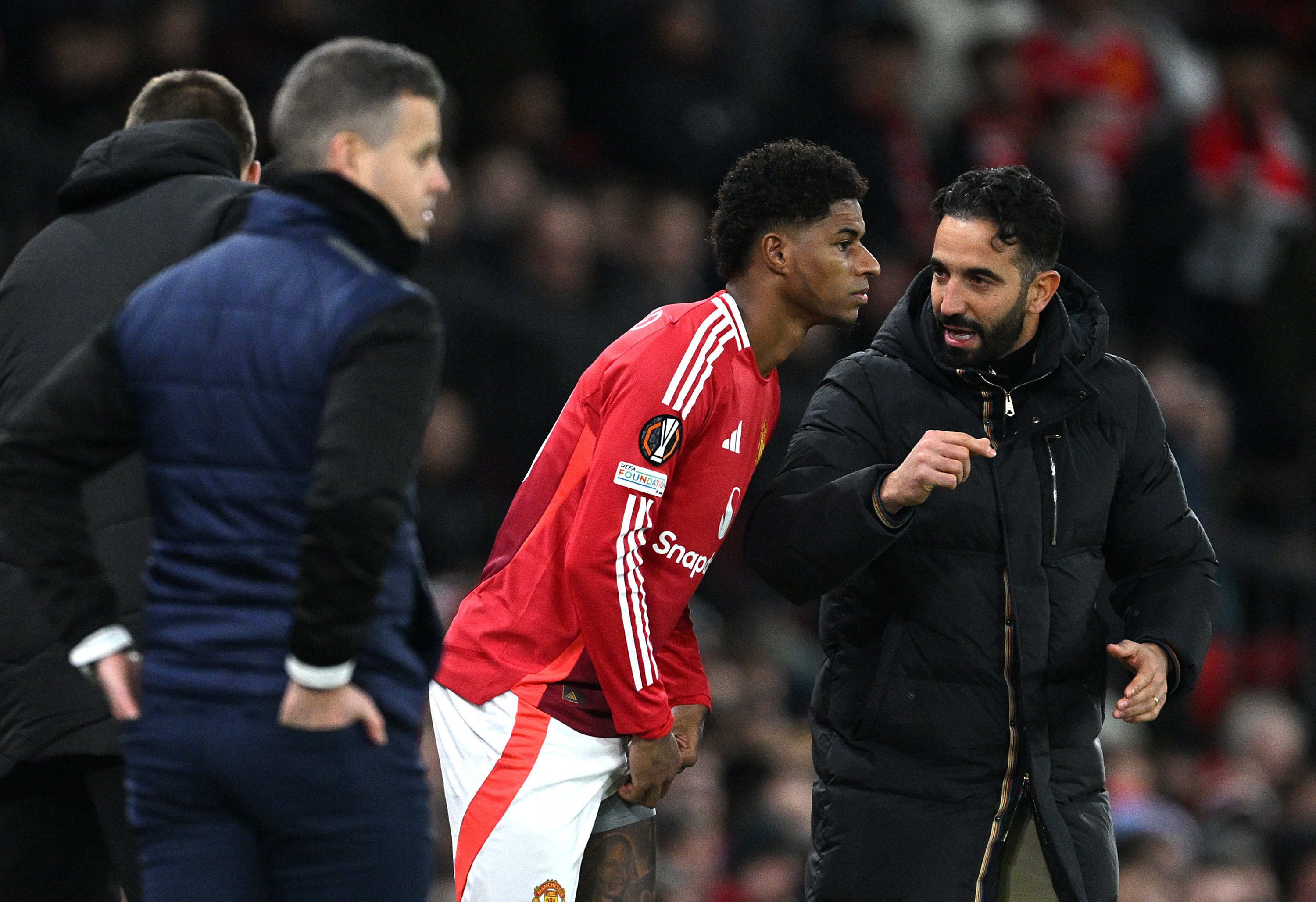 Ruben Amorim, Head Coach of Manchester United, speaks to Marcus Rashford