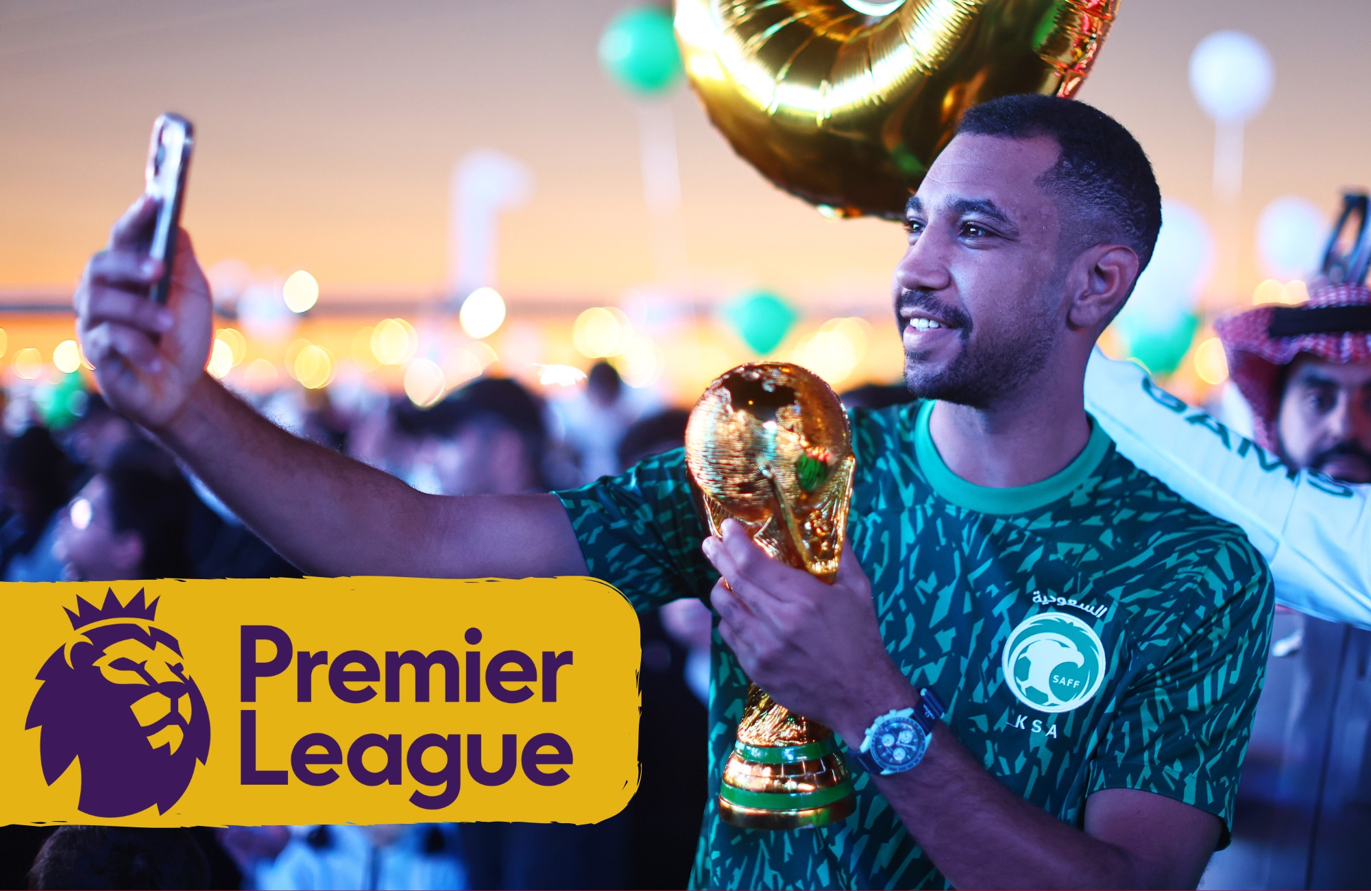 Football fan takes a selfie with a replica of World Cup trophy after Saudi Arabia announcement.