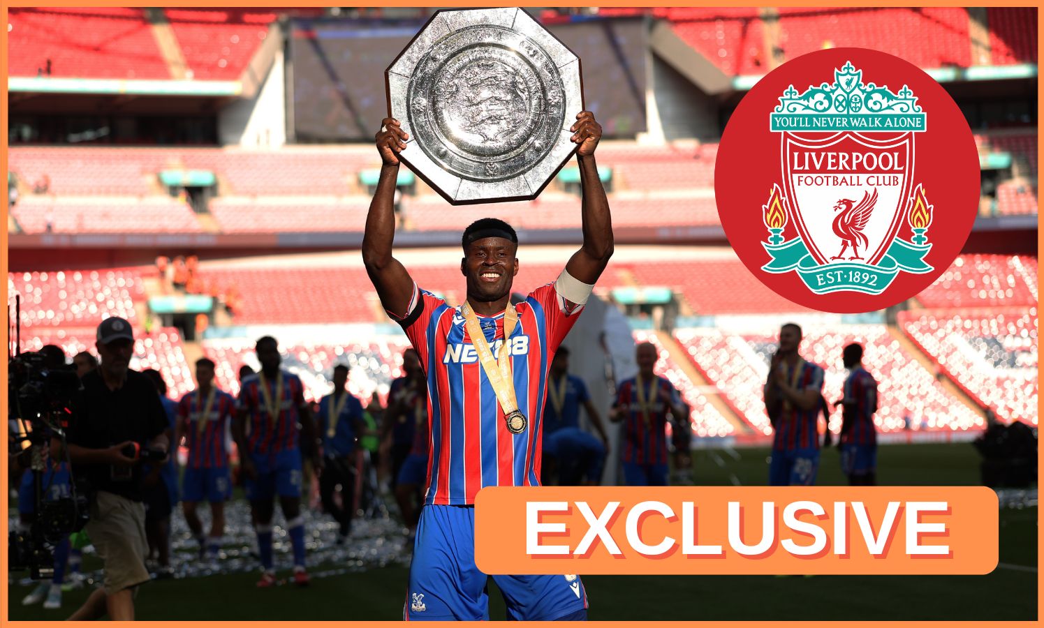 Marc Guehi celebrates by lifting the Community Shield trophy