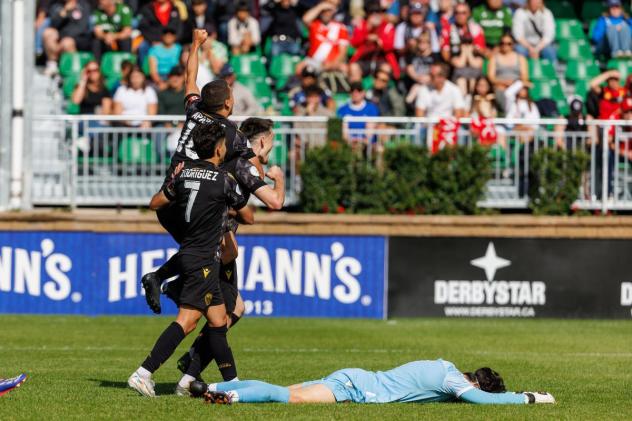 Sam Salter and Atlético Ottawa celebrate a goal vs. Cavalry FC