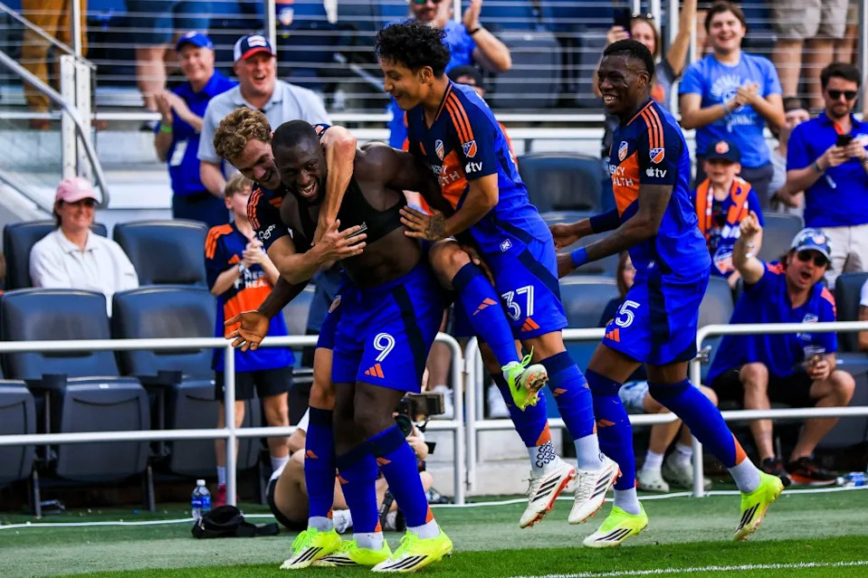 FC Cincinnati players celebrate after scoring a goal. Katie Stratman-Imagn Images
